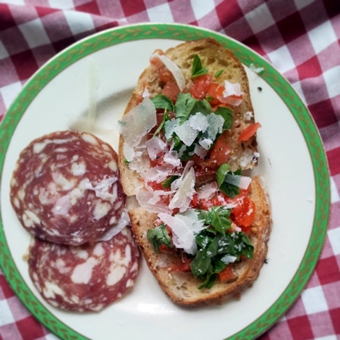 Tomato and basil toast with salami